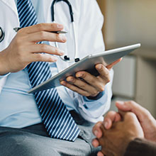 doctor with tablet