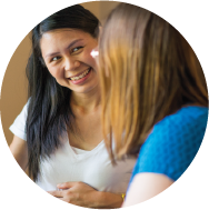 A pregnant woman meeting with a birth doula